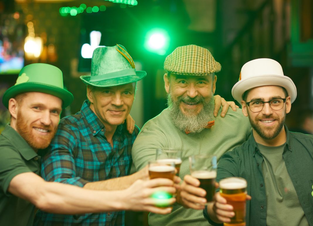 a group of 4 men enjoy St. Patrick's Day