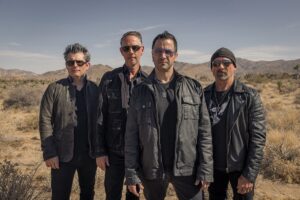 the U2 tribute band LA Vation poses in the desert